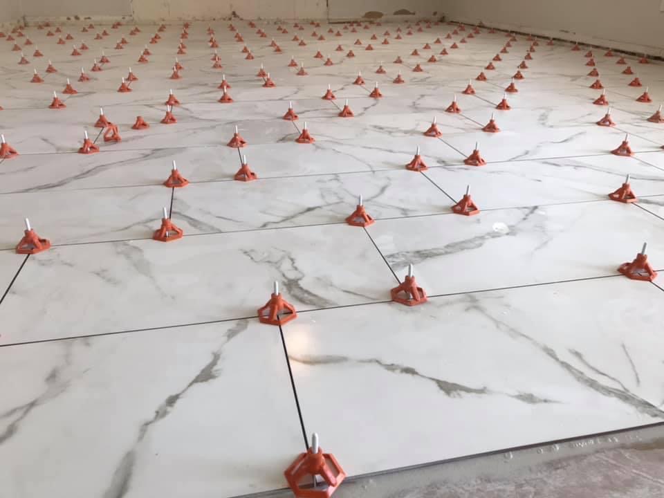 Large format porcelain tile floor continuing through connected Scottsdale living areas